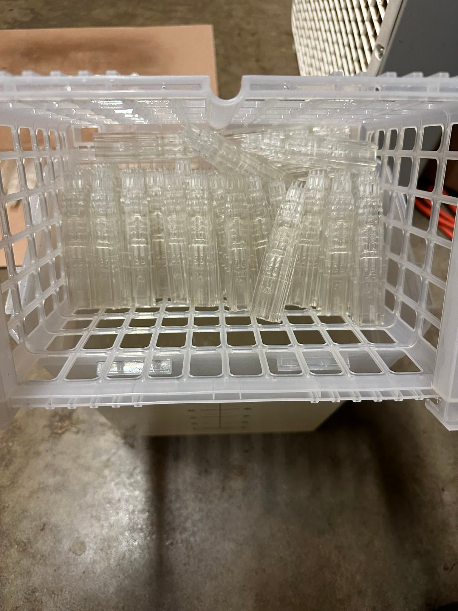 Clear printed Harkness Tower parts collected after fabrication