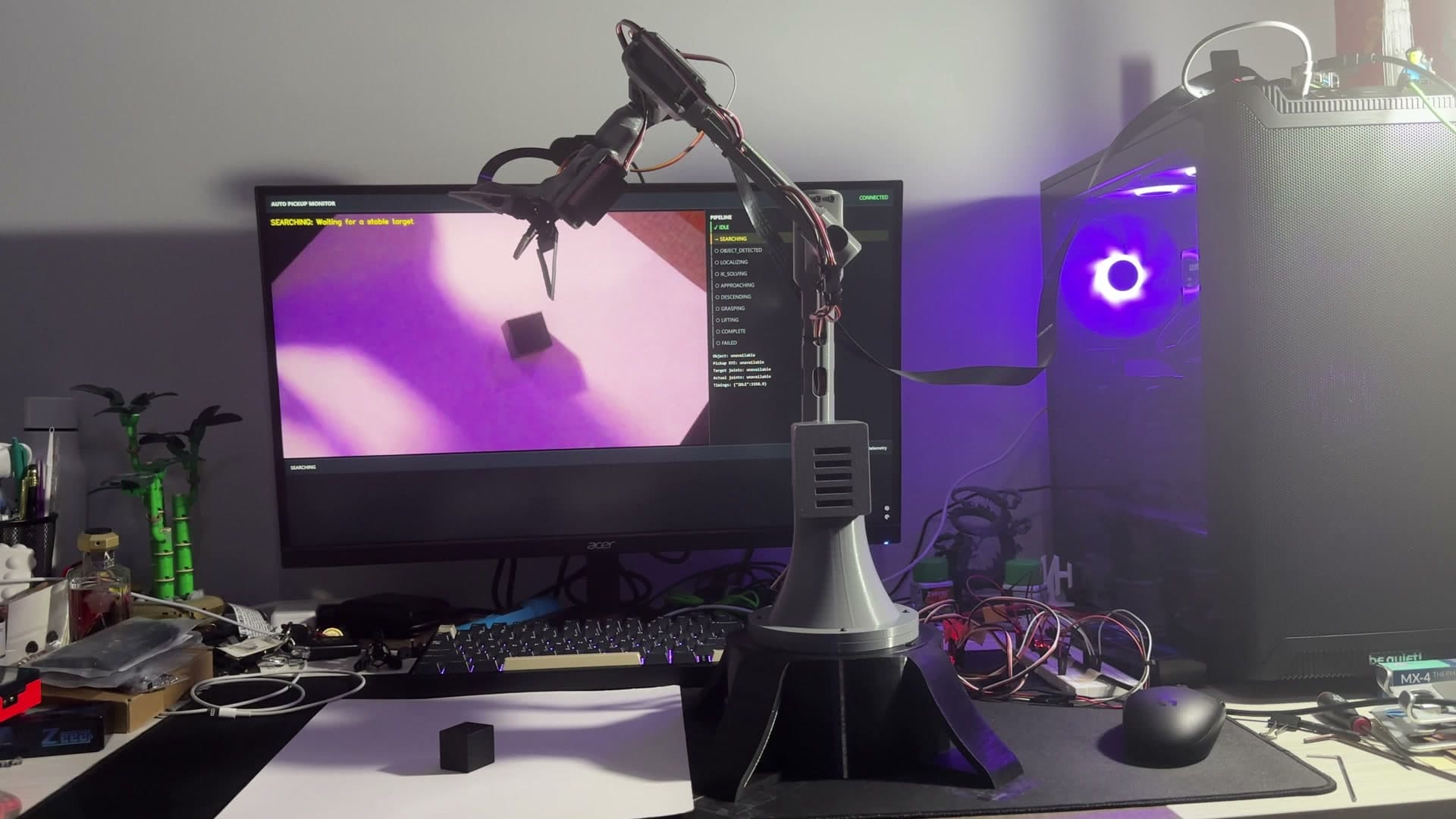 Physical robotic arm detecting objects with its eye-in-hand vision system poster